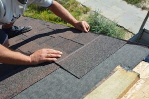 Roofer working on roof Tampa roof replacement.
