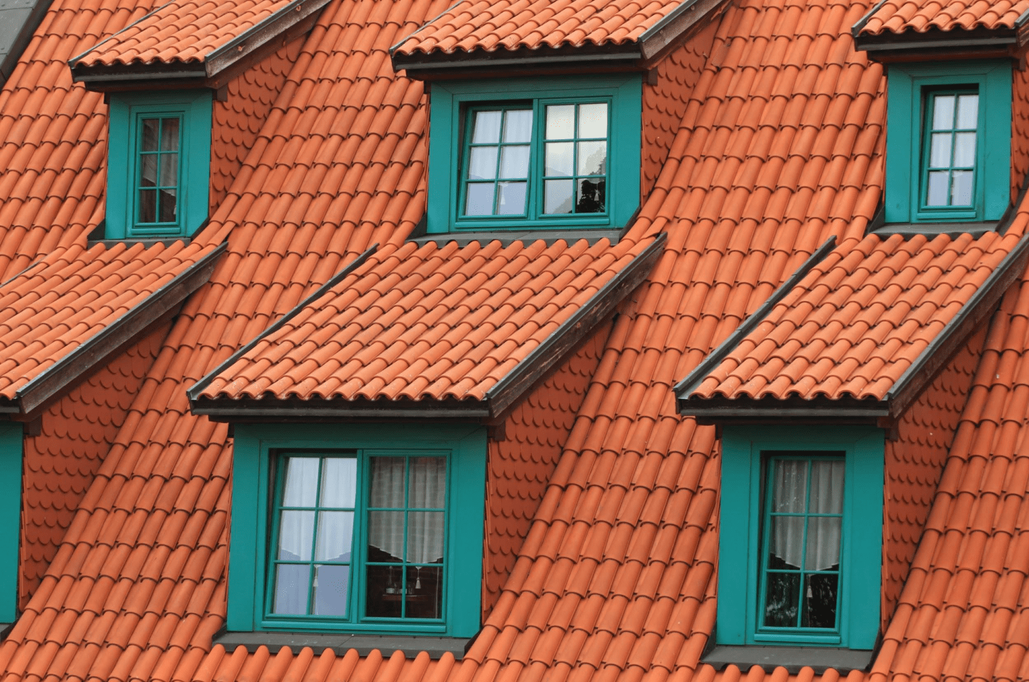 A close-up shot of a building with a clay roof.
