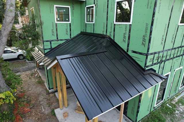 black standing seam metal roofs in new construction